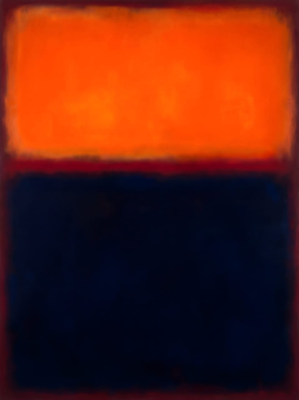 Abstract art above a credenza in a warm living room